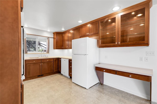 3022 Blackhawk St, Aurora, CO 80011 - kitchen with a sink, white appliances, light countertops, visible vents, and glass insert cabinets