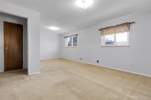 3022 Blackhawk St, Aurora, CO 80011 - unfurnished bedroom featuring light colored carpet, baseboards, and visible vents