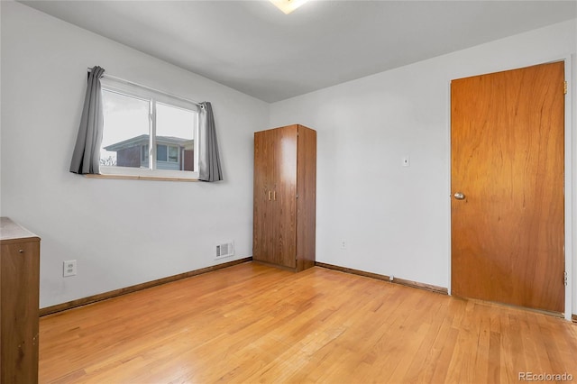 3022 Blackhawk St, Aurora, CO 80011 - unfurnished room featuring baseboards, wood finished floors, and visible vents