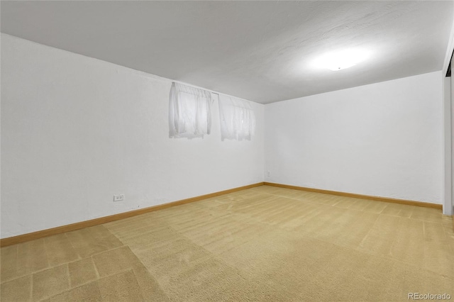 3022 Blackhawk St, Aurora, CO 80011 - finished below grade area with light colored carpet and baseboards