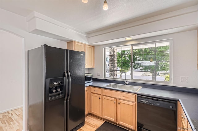 18807 E 51st Pl, Denver, CO 80249 - kitchen featuring black appliances, a sink, light wood-style floors, dark countertops, and a textured ceiling