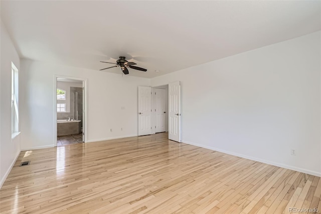 18807 E 51st Pl, Denver, CO 80249 - spare room with a ceiling fan, baseboards, and light wood-style floors