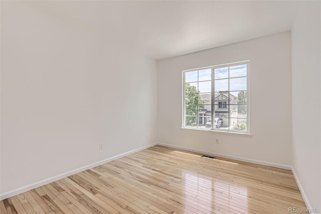 18807 E 51st Pl, Denver, CO 80249 - empty room with light wood-type flooring and baseboards