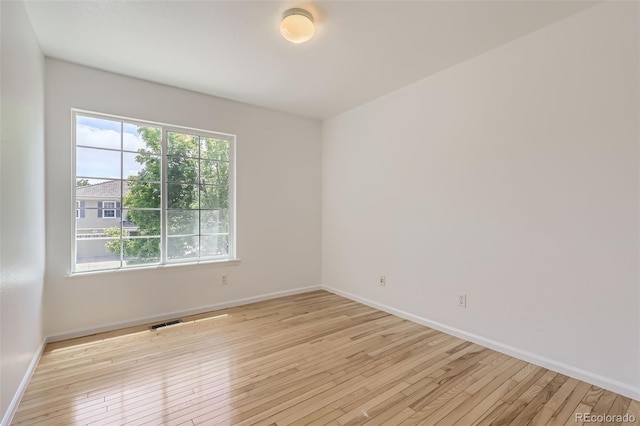 18807 E 51st Pl, Denver, CO 80249 - empty room with light wood finished floors and baseboards