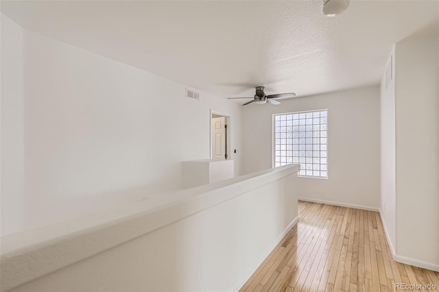 18807 E 51st Pl, Denver, CO 80249 - corridor with light wood-style floors and baseboards