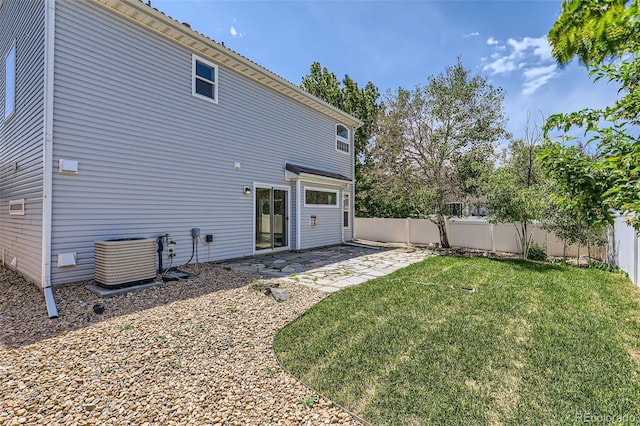 18807 E 51st Pl, Denver, CO 80249 - rear view of property with central AC and a patio