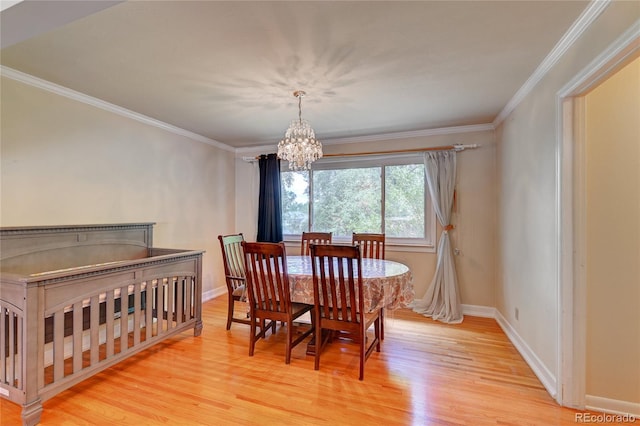 6971 S Valentia St, Centennial, CO 80112 - dining space featuring light wood finished floors, a chandelier, ornamental molding, and baseboards