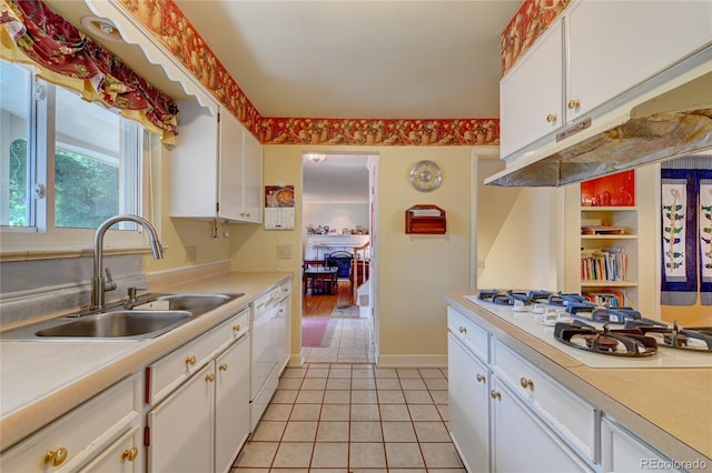 6971 S Valentia St, Centennial, CO 80112 - kitchen with a sink, white appliances, light countertops, and white cabinets