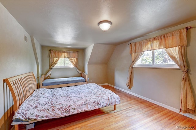 6971 S Valentia St, Centennial, CO 80112 - bedroom with light wood-type flooring and baseboards