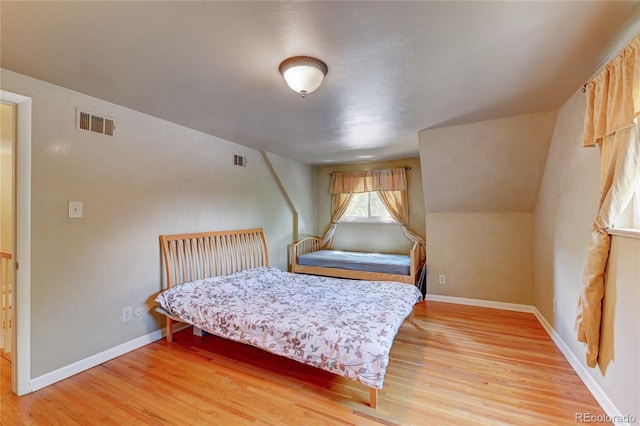 6971 S Valentia St, Centennial, CO 80112 - bedroom with light wood finished floors and baseboards