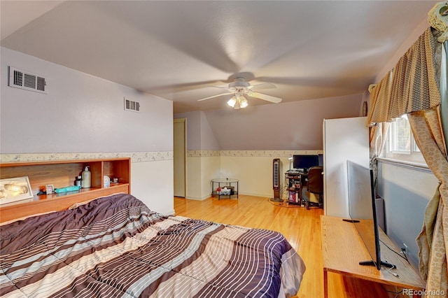 6971 S Valentia St, Centennial, CO 80112 - bedroom with wood finished floors and a ceiling fan