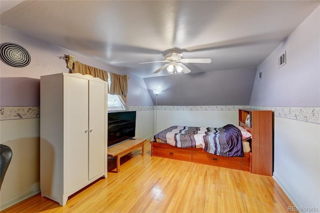 6971 S Valentia St, Centennial, CO 80112 - bedroom with wood finished floors, lofted ceiling, and ceiling fan