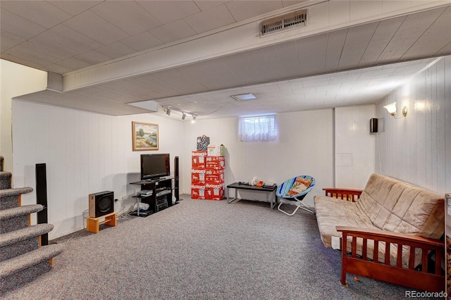 6971 S Valentia St, Centennial, CO 80112 - carpeted living room with stairs and wooden walls