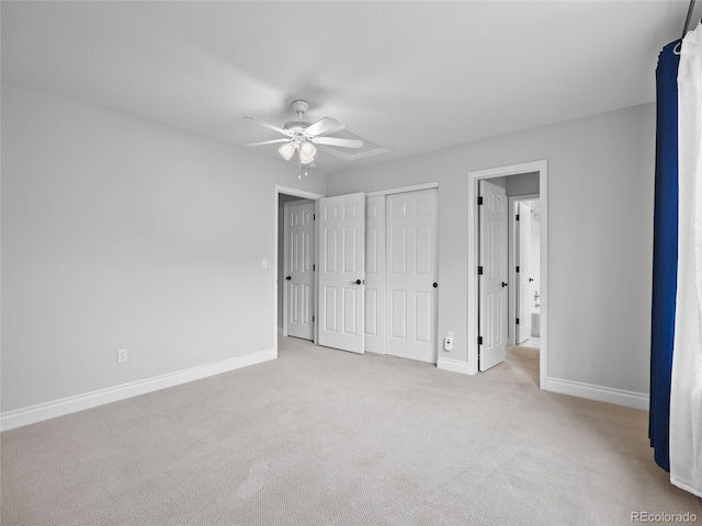 unfurnished bedroom with a closet, baseboards, a ceiling fan, and carpet flooring