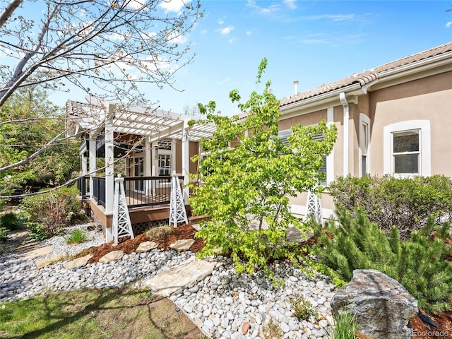 view of yard featuring a pergola and a deck