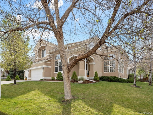 traditional-style home featuring a front lawn and stucco siding