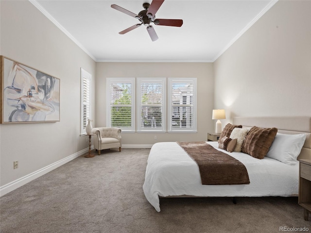 carpeted bedroom featuring crown molding, a ceiling fan, and baseboards