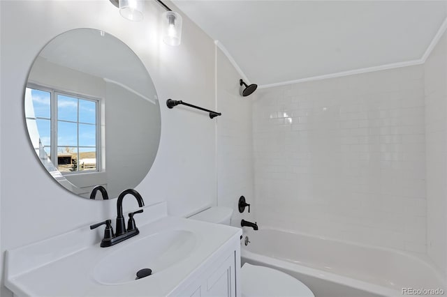 full bathroom featuring vanity, toilet, tiled shower / bath, and ornamental molding