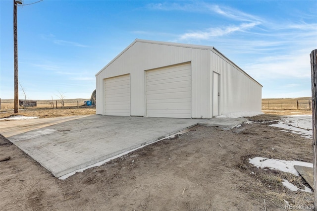 garage featuring a rural view