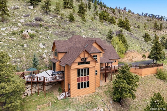 33095 Bergen Mountain Rd, Evergreen, CO 80439 - rear view of house featuring a deck with mountain view and roof with shingles