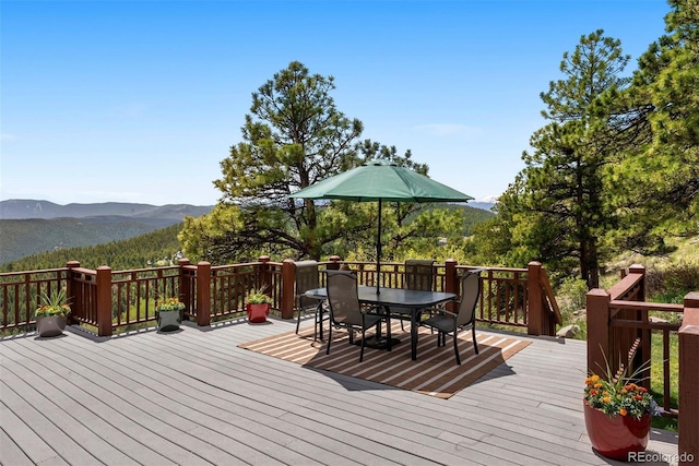 33095 Bergen Mountain Rd, Evergreen, CO 80439 - wooden terrace featuring a mountain view and outdoor dining space