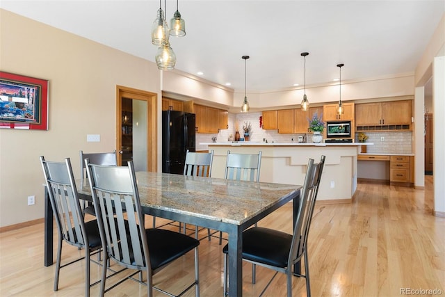 33095 Bergen Mountain Rd, Evergreen, CO 80439 - dining space with light wood-style floors and baseboards