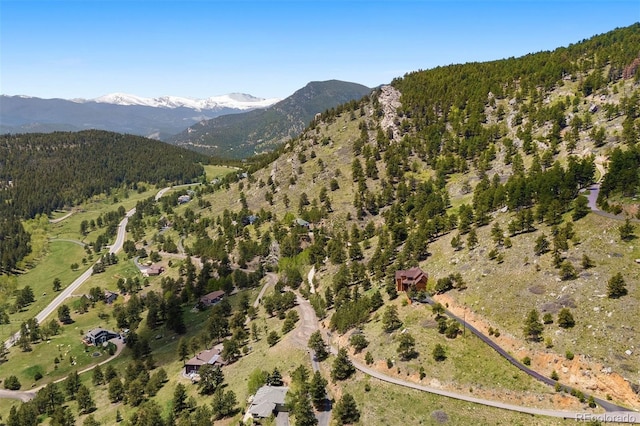 33095 Bergen Mountain Rd, Evergreen, CO 80439 - aerial view of property and surrounding area featuring a mountainous background and a forest