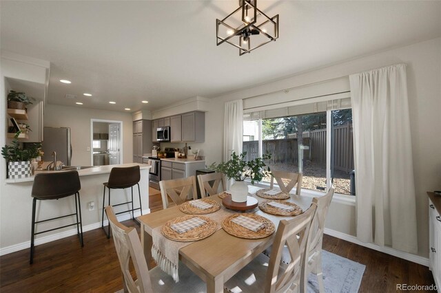20000 Mitchell Pl Unit 9, Denver, CO 80249 - dining room with a notable chandelier, dark wood-type flooring, baseboards, and recessed lighting