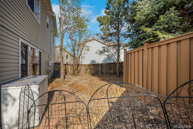 20000 Mitchell Pl Unit 9, Denver, CO 80249 - view of yard featuring central air condition unit and a fenced backyard