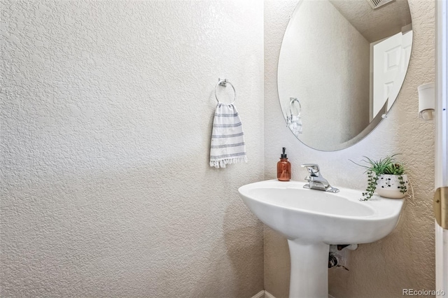 20000 Mitchell Pl Unit 9, Denver, CO 80249 - bathroom with a textured wall and visible vents