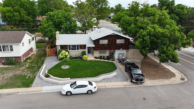 147 Wallace St, Northglenn, CO 80234 - split level home featuring a chimney and roof with shingles