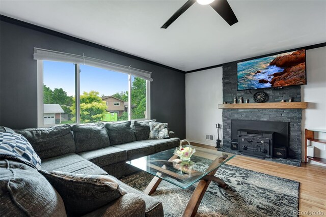 147 Wallace St, Northglenn, CO 80234 - living room with crown molding, a ceiling fan, wood finished floors, and baseboards