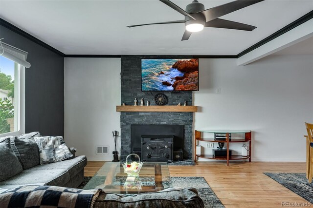 147 Wallace St, Northglenn, CO 80234 - living area with crown molding, a ceiling fan, and wood finished floors