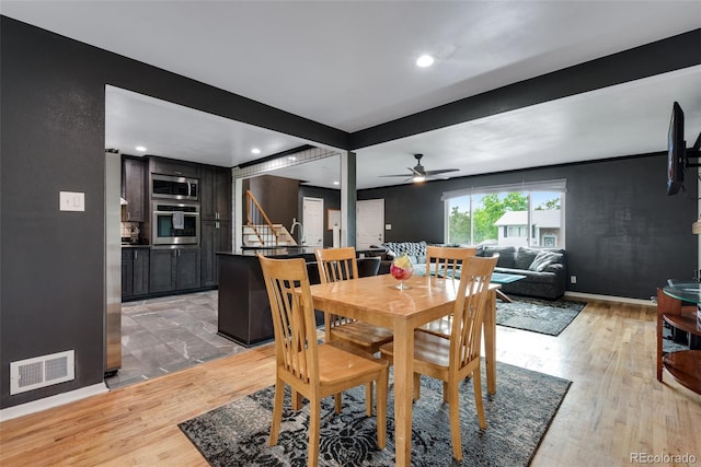 147 Wallace St, Northglenn, CO 80234 - dining room featuring stairway, a ceiling fan, light wood-style flooring, baseboards, and recessed lighting