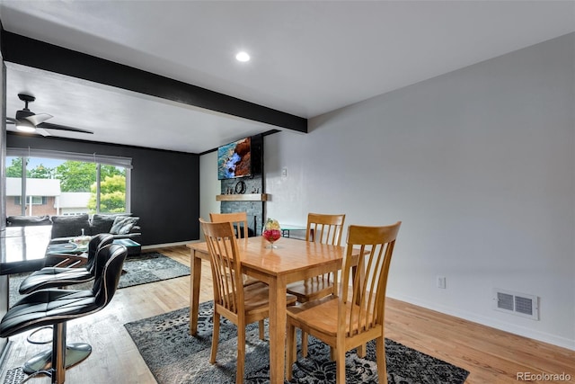 147 Wallace St, Northglenn, CO 80234 - dining area featuring beam ceiling, a ceiling fan, light wood finished floors, and baseboards