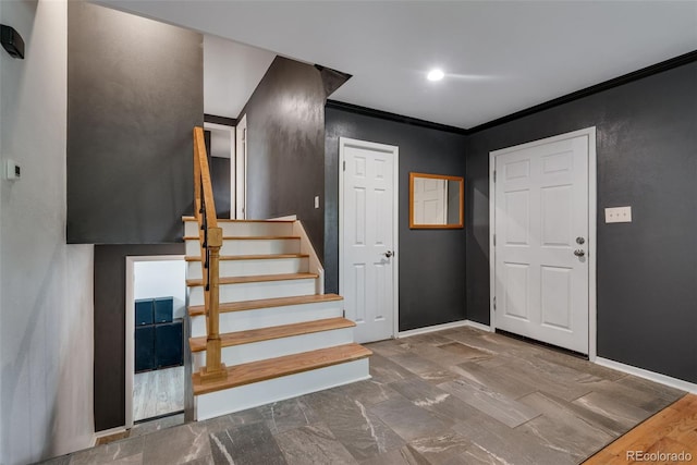 147 Wallace St, Northglenn, CO 80234 - foyer featuring crown molding, stairway, and baseboards