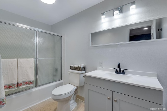 147 Wallace St, Northglenn, CO 80234 - bathroom featuring vanity, combined bath / shower with glass door, and toilet