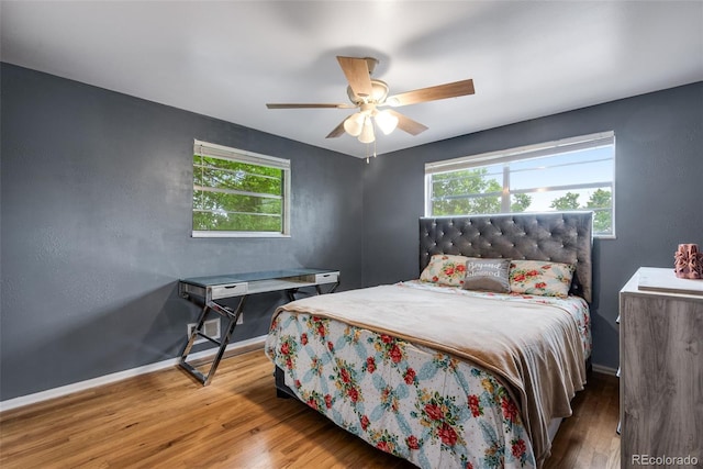 147 Wallace St, Northglenn, CO 80234 - bedroom with wood finished floors, baseboards, and a ceiling fan