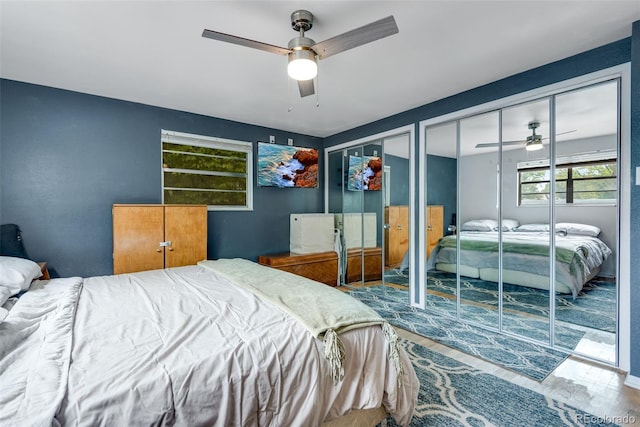 147 Wallace St, Northglenn, CO 80234 - bedroom with wood finished floors, two closets, and ceiling fan