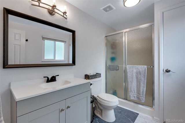 147 Wallace St, Northglenn, CO 80234 - bathroom with vanity, toilet, and a stall shower