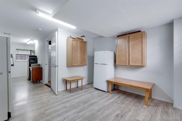 147 Wallace St, Northglenn, CO 80234 - kitchen featuring freestanding refrigerator, light wood-style flooring, baseboards, and light brown cabinets