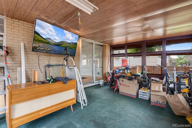 147 Wallace St, Northglenn, CO 80234 - sunroom / solarium with wooden ceiling, carpet floors, and brick wall