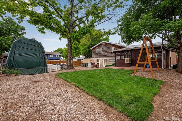 147 Wallace St, Northglenn, CO 80234 - view of yard featuring a sunroom