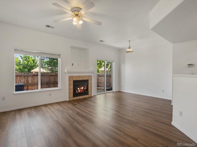 9024 Gale Blvd Unit 3, Thornton, CO 80260 - unfurnished living room with wood finished floors, a tile fireplace, and ceiling fan