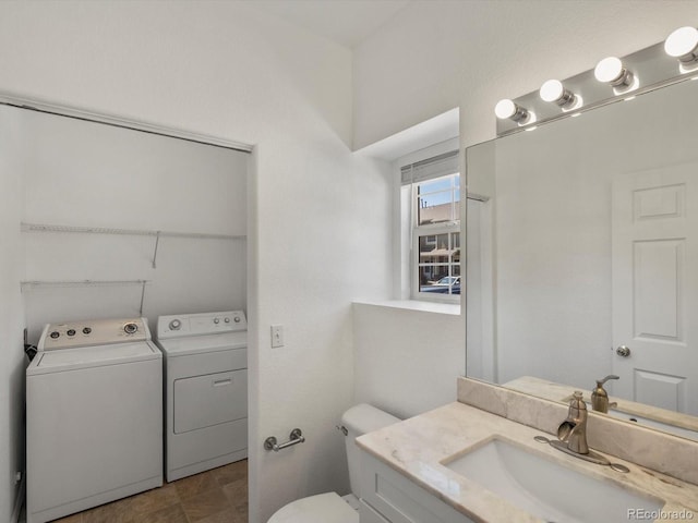 9024 Gale Blvd Unit 3, Thornton, CO 80260 - half bathroom with washing machine and clothes dryer and vanity