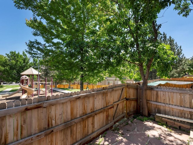 9024 Gale Blvd Unit 3, Thornton, CO 80260 - fenced backyard featuring a playground