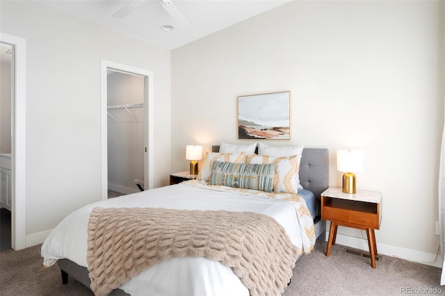 bedroom with carpet floors, a closet, and baseboards