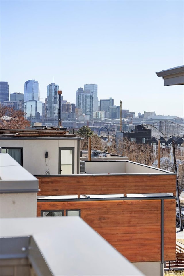 view of patio / terrace with a balcony and a city view