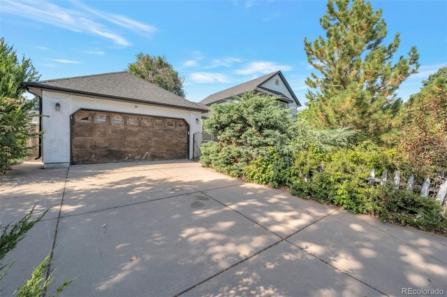 view of side of home with a garage