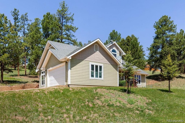 1563 Southpark Rd, Florissant, CO 80816 - view of side of home with a yard and an attached garage